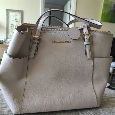 michael kors väska beige|Michael Kors clothing.